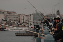 black and brown fishing rod — Photo Tolga Ahmetler / Unsplash