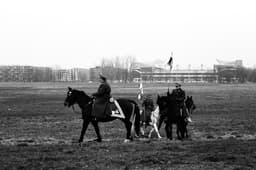 a black and white photo of a group of people on horses — Photo Daniel Silva / Unsplash