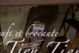 a stack of magazines sitting on top of a wicker chair — Photo Kouji Tsuru / Unsplash