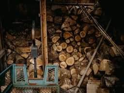 a pile of wood sitting next to a pile of logs — Photo Annie Spratt / Unsplash