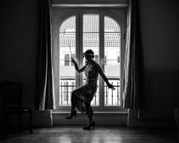 a person dancing in a room — Photo Carrie Borden / Unsplash