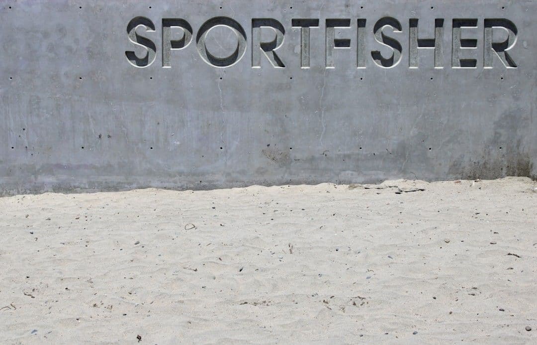 "sportfisher" is etched into concrete wall. — Photo Ryan Waldman / Unsplash