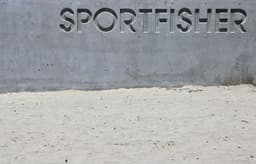 "sportfisher" is etched into concrete wall. — Photo Ryan Waldman / Unsplash