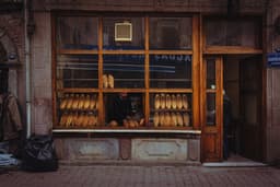 a person standing in a window — Photo Mehmet Uzut / Unsplash