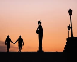 silhouette of people walking on the beach during sunset — Photo Michiel Annaert / Unsplash