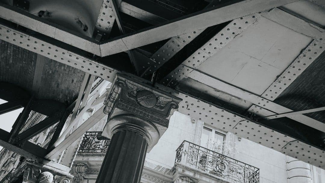 A black and white image of architecture and metal. — Photo Cande Westh / Unsplash