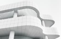 Modern building with a wave shaped exterior
— Photo Mika Ruusunen / Unsplash