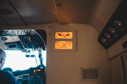 a man sitting in the cockpit of a plane — Photo Erik Mclean / Unsplash