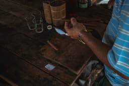 person wearing silver link bracelet watch — Photo Alex Plesovskich / Unsplash