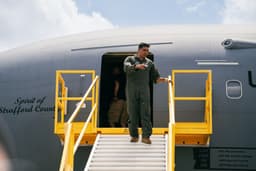 Pilot walks down stairs from airplane — Photo Maryam Tello / Unsplash