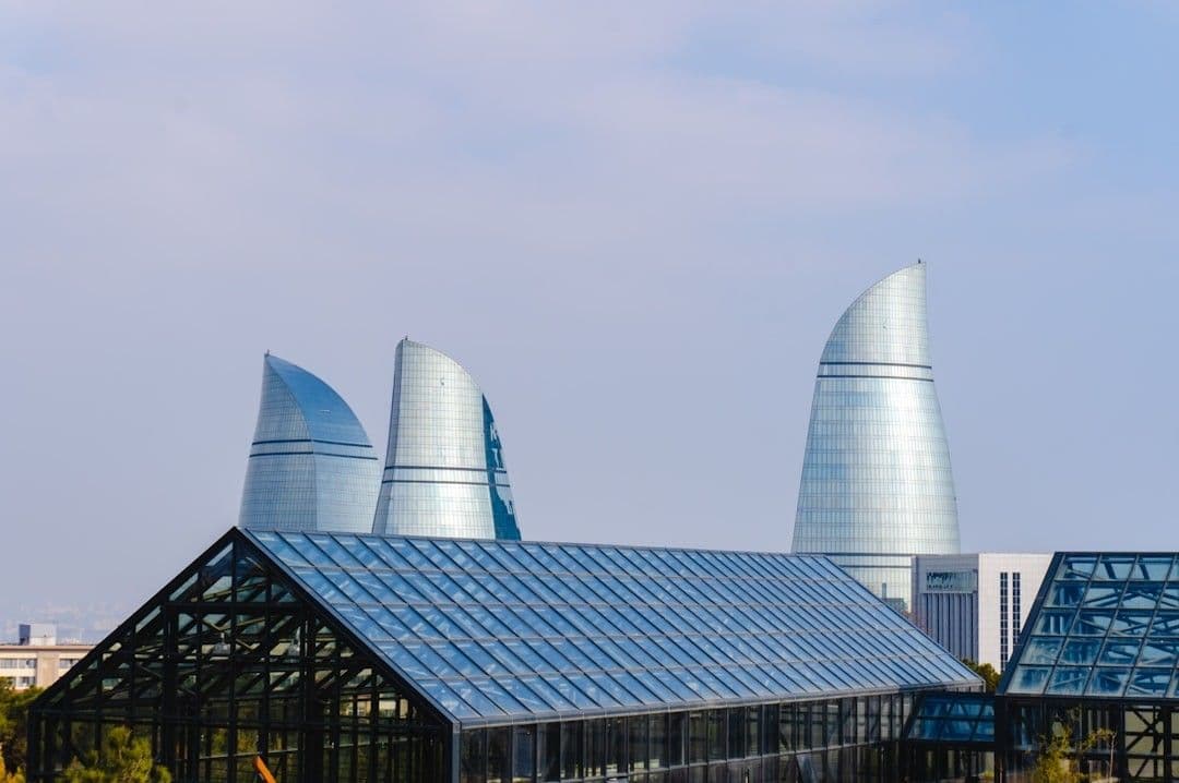 Flame towers in baku are visible in the sky. — Photo Zulfugar Karimov / Unsplash