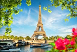 a beautiful Eiffel tower Image with flower decor — Photo Ali Rizvi / Unsplash