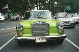 a green car on the street — Photo Xennie Moore / Unsplash