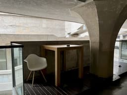 a room with a desk and chairs — Photo KJ Brix / Unsplash