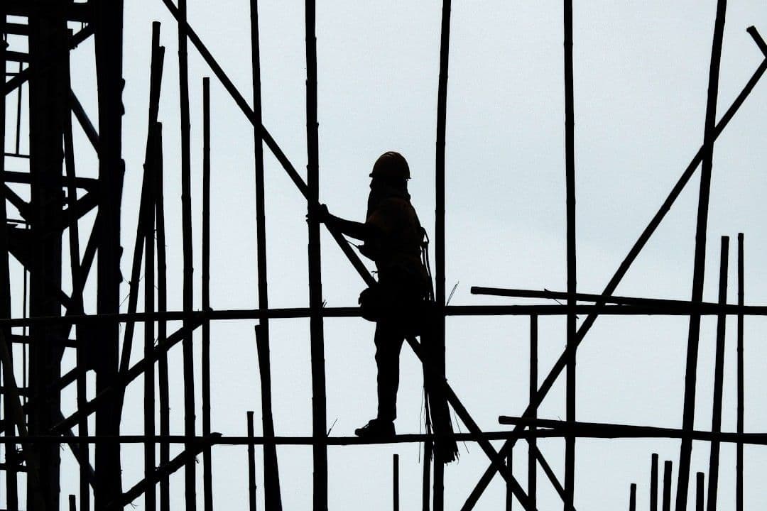 a person climbing a ladder — Photo Thomas Kinto / Unsplash