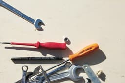 red and silver hand tool — Photo Elena Rouame / Unsplash