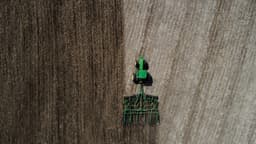 Top down drone shot of tractor disking. — Photo Josh Berendes / Unsplash