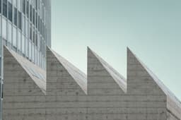 gray concrete structure — Photo Javier Segura / Unsplash