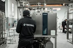Technician inspecting a tangential flow filtration system in an industrial facility. — Photo TECNIC Bioprocess Solutions / Unsplash
