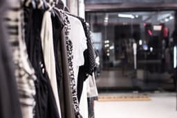 clothes hanged on clothes hanger — Photo Artem Beliaikin / Unsplash