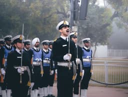 A group of men in uniform standing next to each other — Photo Pramod Tiwari / Unsplash