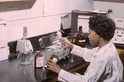 This historic 1965 photograph, depicted a laboratory technician, as she was measuring out various powdered chemicals, which would subsequently be combined in order to formulate reagents to be used in conjunction with an AutoAnalyzer®. The AutoAnalyzer®, manufactured by the former Technicon Corporation, used a continuous flow analysis (CFA) technique, which automated what was once a manual process of sample analysis. — Photo CDC / Unsplash