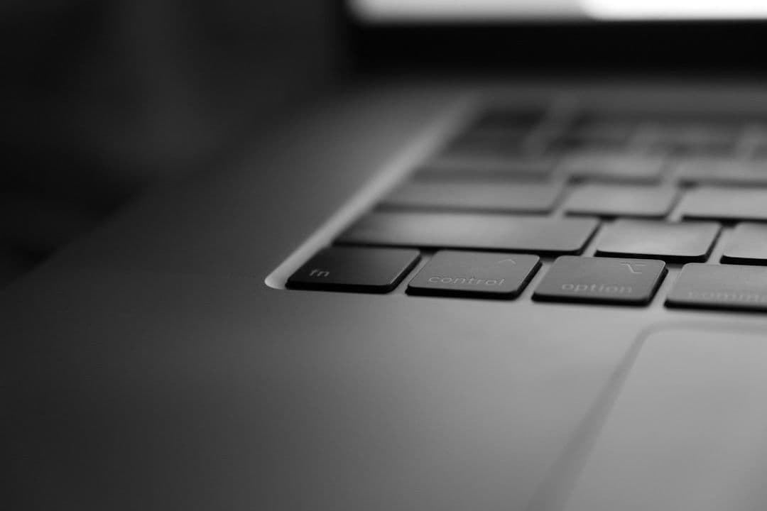 a black and white photo of a laptop keyboard — Photo Dima Solomin / Unsplash