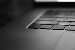a black and white photo of a laptop keyboard — Photo Dima Solomin / Unsplash