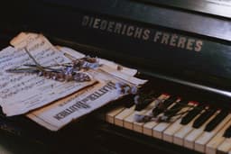 a sheet of music sitting on top of a piano — Photo Anna Zakharova / Unsplash