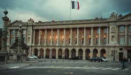 a large building with a flag on top of it — Photo Anna Hunko / Unsplash